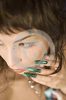 Nails near cheek photo