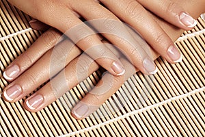 Nails with perfect french manicure. Care for female hands.