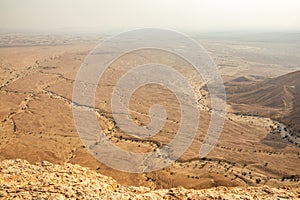 The Najd desert wasteland landscape panorama view from Jabal Tuwaiq, Riyadh, Saudi Arabia