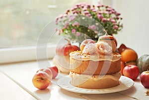 Naked Cake with Apples. Thanksgiving Day table. Happy Halloween Pumpkins, apples and flowers. Bright autumn background. Colorful