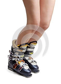 Naked female legs in ski boots