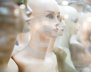 Naked female mannequins in the shop window