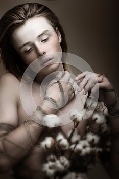 Naked Handsome Young Man with Bunch of Flowers. Passion