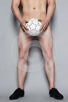 Naked muscle man with ball