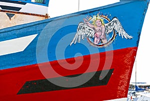 Naked peeing angel at the bow of a fishing boat