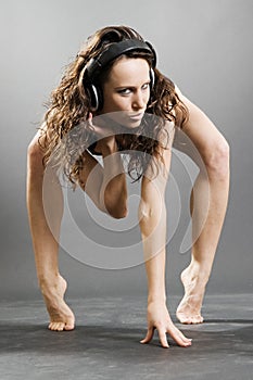 Naked woman with earphones