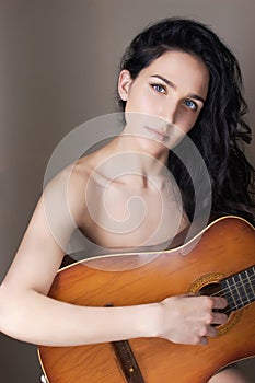 Naked woman with guitar