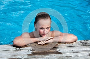 Naked woman in swimming pool