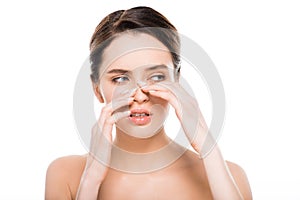 Naked woman touching nose after rhinoplasty isolated on white