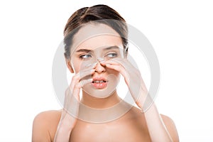 Naked woman touching nose after rhinoplasty isolated on white photo