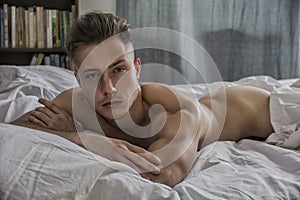 naked young man on bed