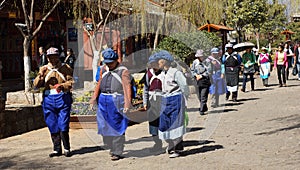 Nakhi is walking to the square in Lijiang