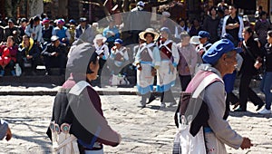 Nakhi women dance around the square in Lijiang