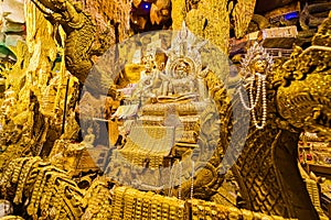 Nakhon Nayok, Thailand - April, 24, 2022 : Inside view Naga Cave for People worship and wish for good luck at Maniwong Temple at photo