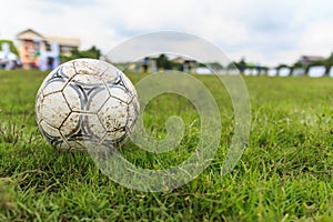 Nakhon Ratchasima, Thailand - October 1 : Muddy soccer ball on a football field in Municipal Stadium Nakhon Ratchasima on October