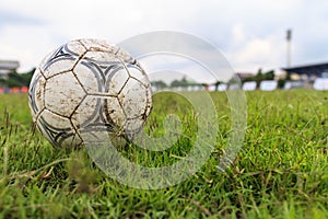 Nakhon Ratchasima, Thailand - October 1 : Muddy soccer ball on a football field in Municipal Stadium Nakhon Ratchasima on October