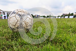 Nakhon Ratchasima, Thailand - October 1 : Muddy soccer ball on a football field in Municipal Stadium Nakhon Ratchasima on October