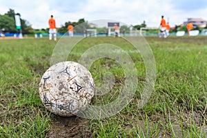 Nakhon Ratchasima, Thailand - October 1 : Muddy soccer ball on a football field in Municipal Stadium Nakhon Ratchasima on October