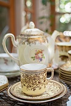 NAKORNPATHOM, THAILAND, MAR 12, 2020 : hand craft artwork on ceramic cup and dish being sell in cafe, THAILAND,