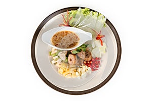 Nam Nuong; Grilled pork balls with condiments and Peanut Sauce from top view on white background photo