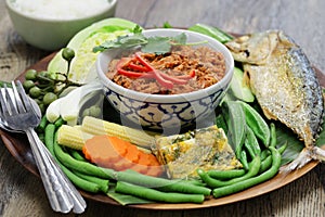 Nam phrik pla thu ; vegetables with short mackerel dipping paste ,  thai food photo