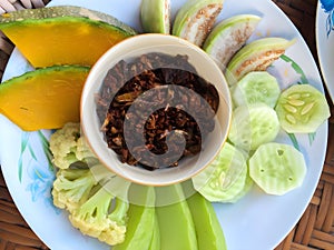 Nam Prik - Thai chili paste dip with mackerel fish meat and fresh vegetables, pumpkin, cucumber, bean and cauliflower. Northern
