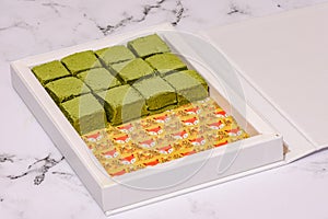 Nama Matcha Chocolate On A White Marble Countertop