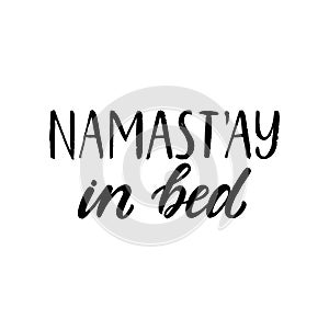 Namastay in bed. Hand written lettering quote. Cozy phrase for winter time. Modern calligraphy poster. Inspirational