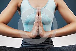 Namaste, praying hands and woman doing a yoga exercise for mind, body and spiritual balance. Fitness, meditation and zen