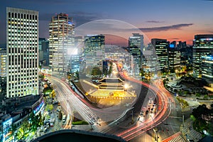 Namdaemun gate with Seoul business district at night in Seoul ,South Korea