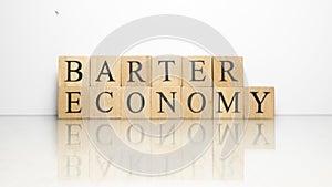 The name Barter Economy was created from wooden letter cubes.