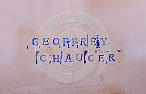 The name of the classic English poet Geoffrey Chaucer (c1340s - 1400) is written in stamped letters.