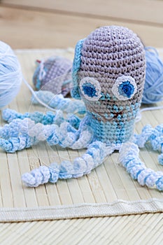 Name:Crocheted woven with colored wool toy octopus close-up