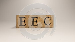 The name EEC was created from wooden letter cubes. Economics and finance.