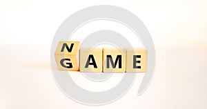 Name of the game symbol. Wooden blocks with concept words Name Game. Beautiful white table white background. Business and name of