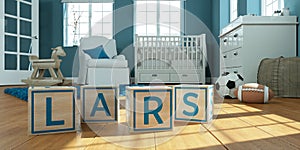 The name lars written with wooden toy cubes in children`s room