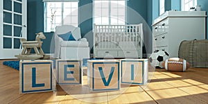 The name levi written with wooden toy cubes in children`s room