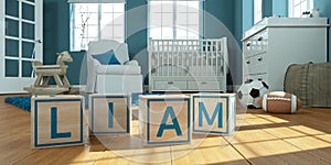 The name liam written with wooden toy cubes in children`s room