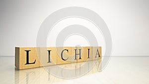 The name Lichia was created from wooden letter cubes. Seafood and food. photo