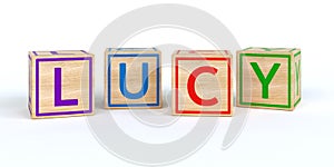 The name lucy written with Isolated wooden toy cubes