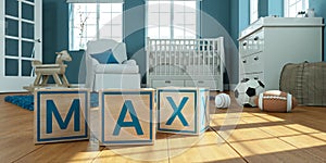 The name max written with wooden toy cubes in children`s room