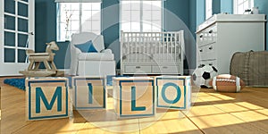 The name milo written with wooden toy cubes in children`s room