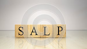 The name Salp was created from wooden letter cubes. Sea creatures and food.