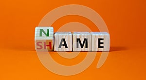 Name or shame symbol. Turned the cube and changed cube and changes the word `shame` to `name` or vice versa. Beautiful orange