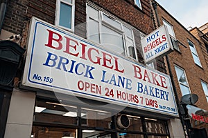 Name sign on the facade of Beigel Bake bakery shop in Brick Lane, London, UK