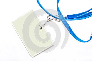 Name tag and blue lanyard on a white background.