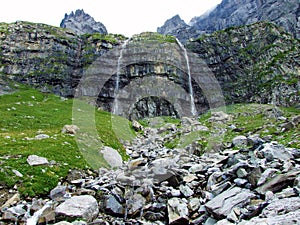 Nameless waterfalls under the Alpine peaks Glarner Vorab and BÃ¼nder Vorab in the valley of Im Loch