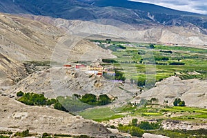 Namgyal Monastery in Upper Mustang of Tibetan Nepal with beautiful green desert