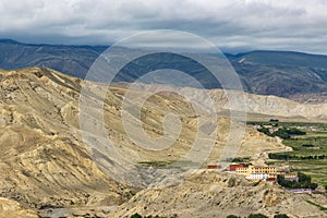 Namgyal Monastery in Upper Mustang of Tibetan Nepal with beautiful green desert