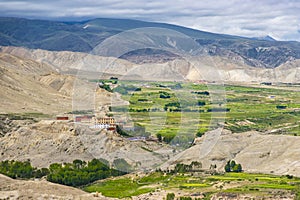 Namgyal Monastery in Upper Mustang of Tibetan Nepal with beautiful green desert